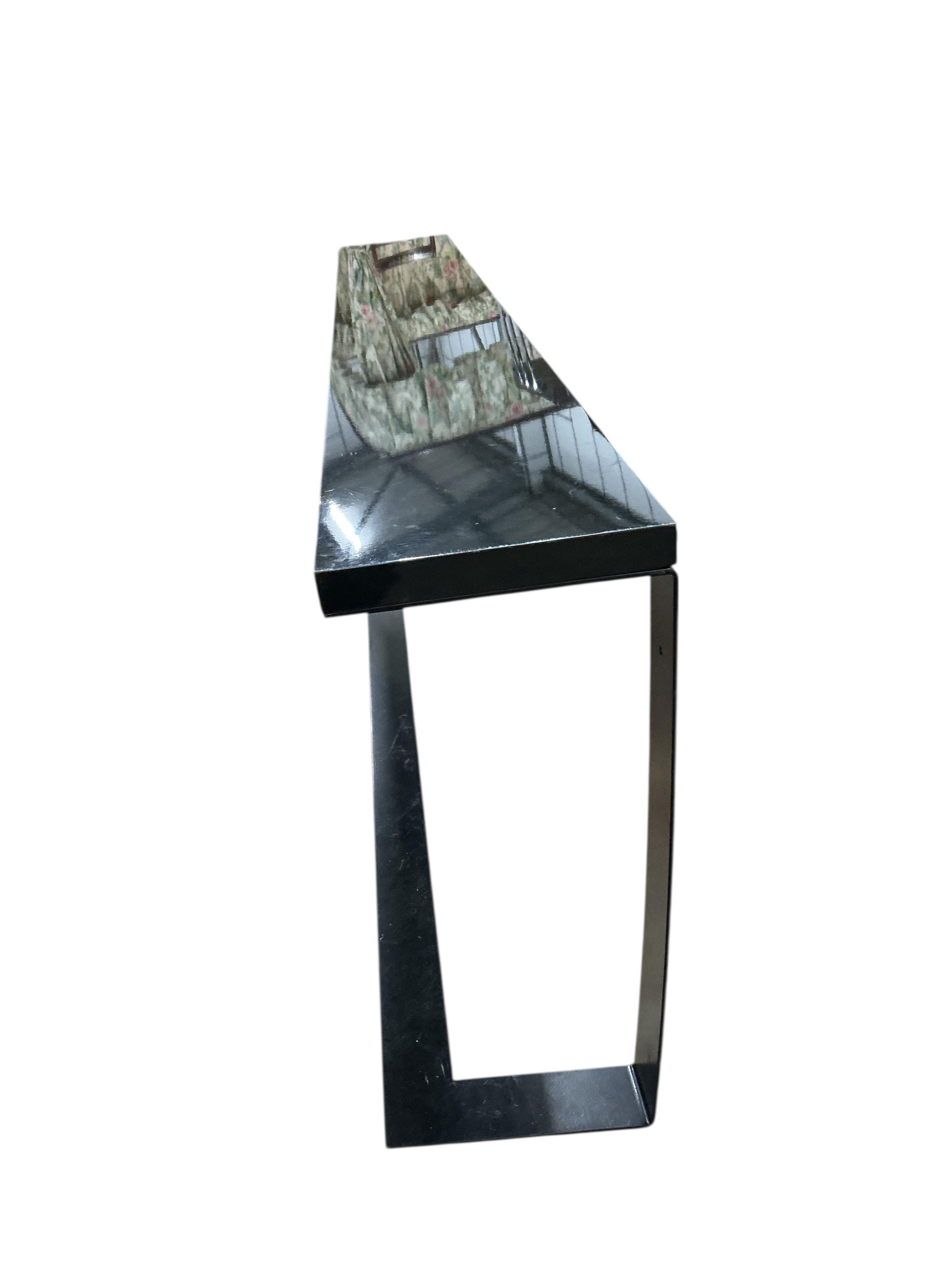 A Contemporary ebonised and black coated metal console table, width 240cm, depth 32cm, height 76cm